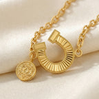 Gold-Plated Horseshoe and Charm Bracelet