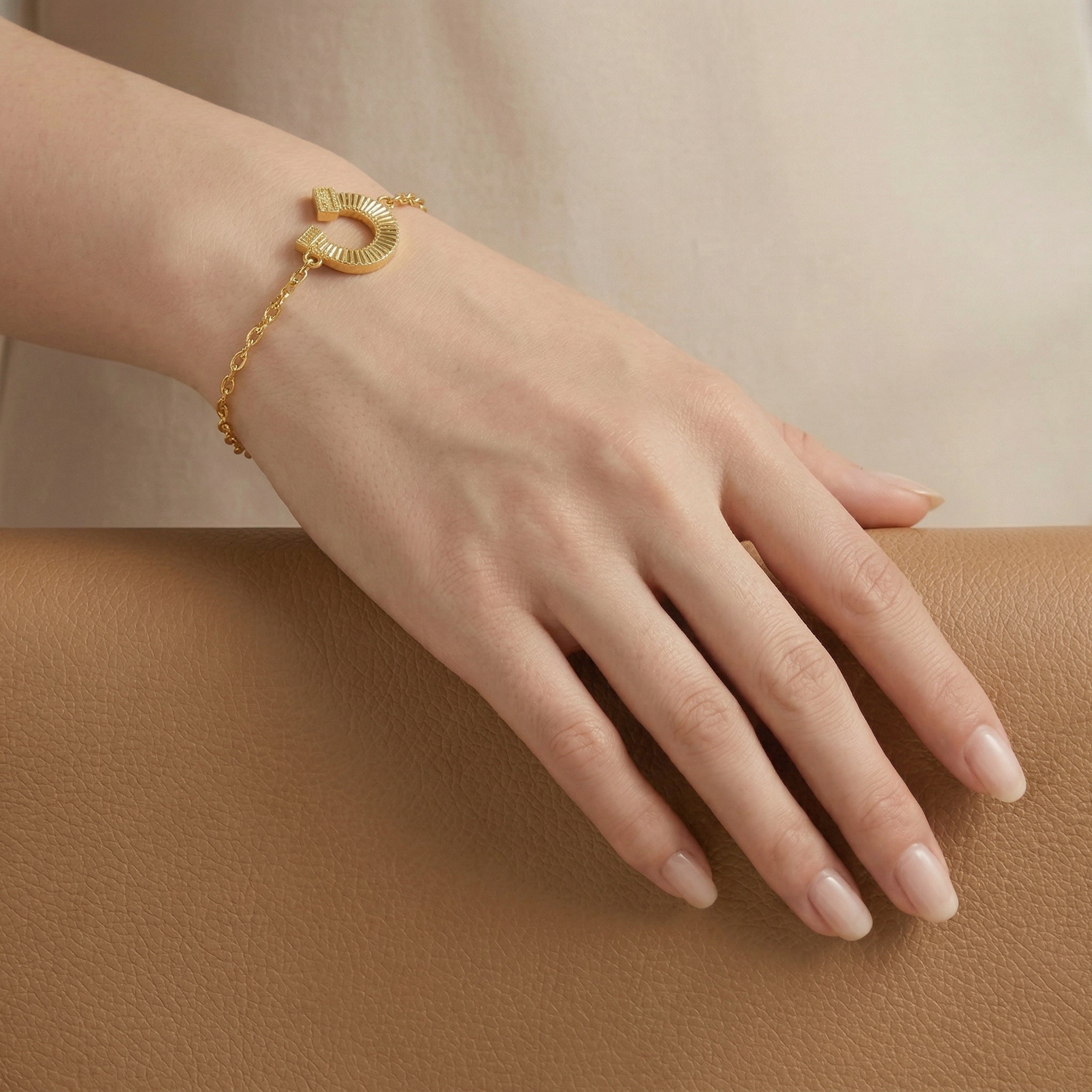 Gold-Plated Horseshoe and Charm Bracelet